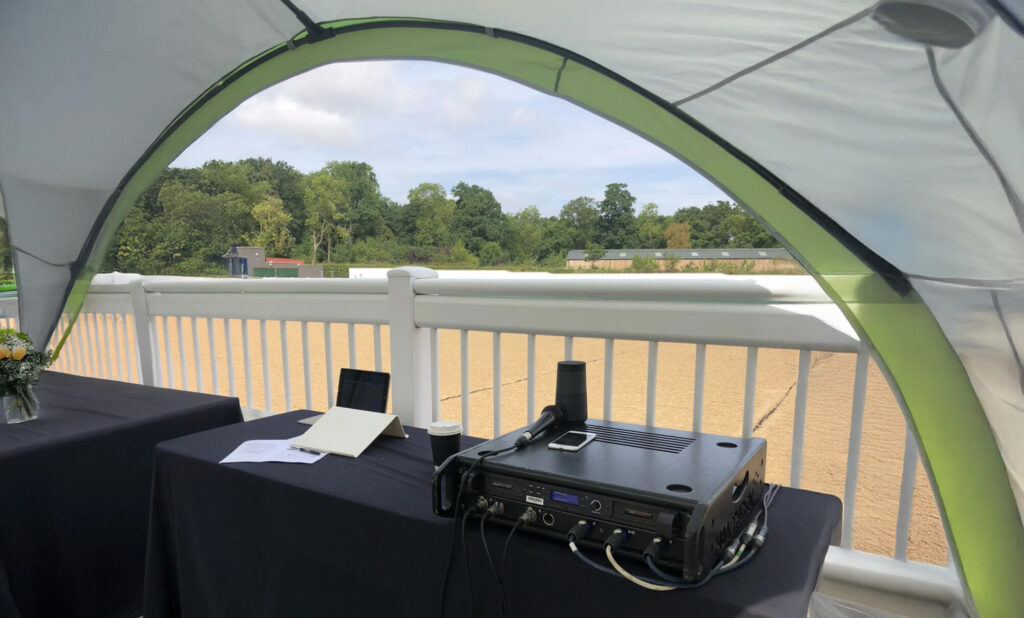 Covered event commentary desk with PA system at Dallas Burston Polo Club – JET event equipment hire Warwickshire