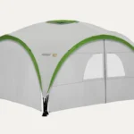 Coleman event shelter with side panels and door for enclosed outdoor setup and weather protection