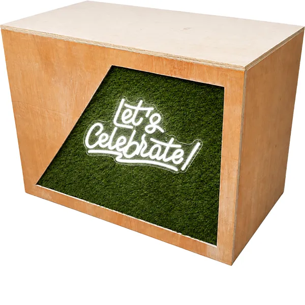 Rustic wooden DJ booth with Let’s Celebrate neon sign and green foliage panel