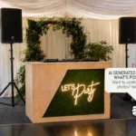 Rustic DJ booth with Let’s Party neon sign inside a marquee event setup