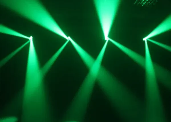Green moving head lighting beams cutting through haze for high-energy event lighting hire