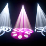 White and pink Chauvet Intimidator Spot 350 beams with circular gobo patterns on a dark floor